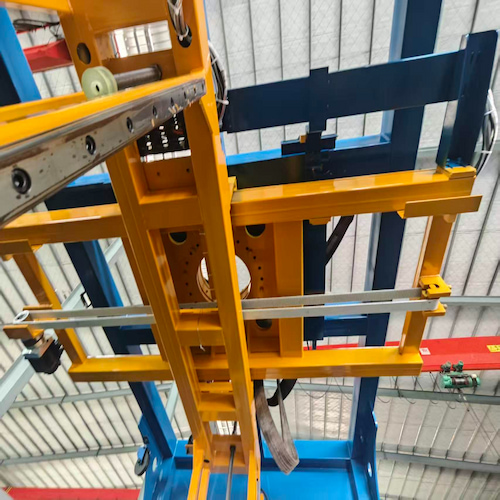 A sword-shaped guide rod extends from the main unit of the packing machine